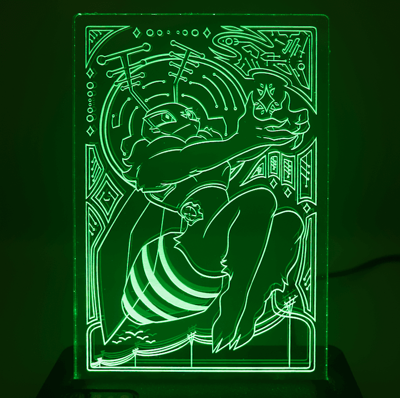 A clear acrylic standee, illuminated with a green light featuring an illustration of one of the Lepi Labs Mascots, Deedee, holding a glowing star in her hand. Electrical poles and a flock of birds are featured in the lower half of the illustration. There are circuitry like markings around the border of the illustration. Art made by makanioverlord